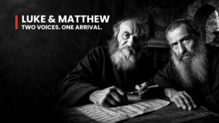 Luke and Matthew, Gospel writers, are imagined at a manuscript, two intent faces illustrating distinct Christmas accounts.