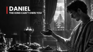 Daniel the exiled court servant looks down with an open palm above a laden table, facing the king's test of loyalty.