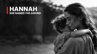 Hannah, Samuel's mother, cradles her child beside a rustic home, recalling the answered prayer preserved in his name.